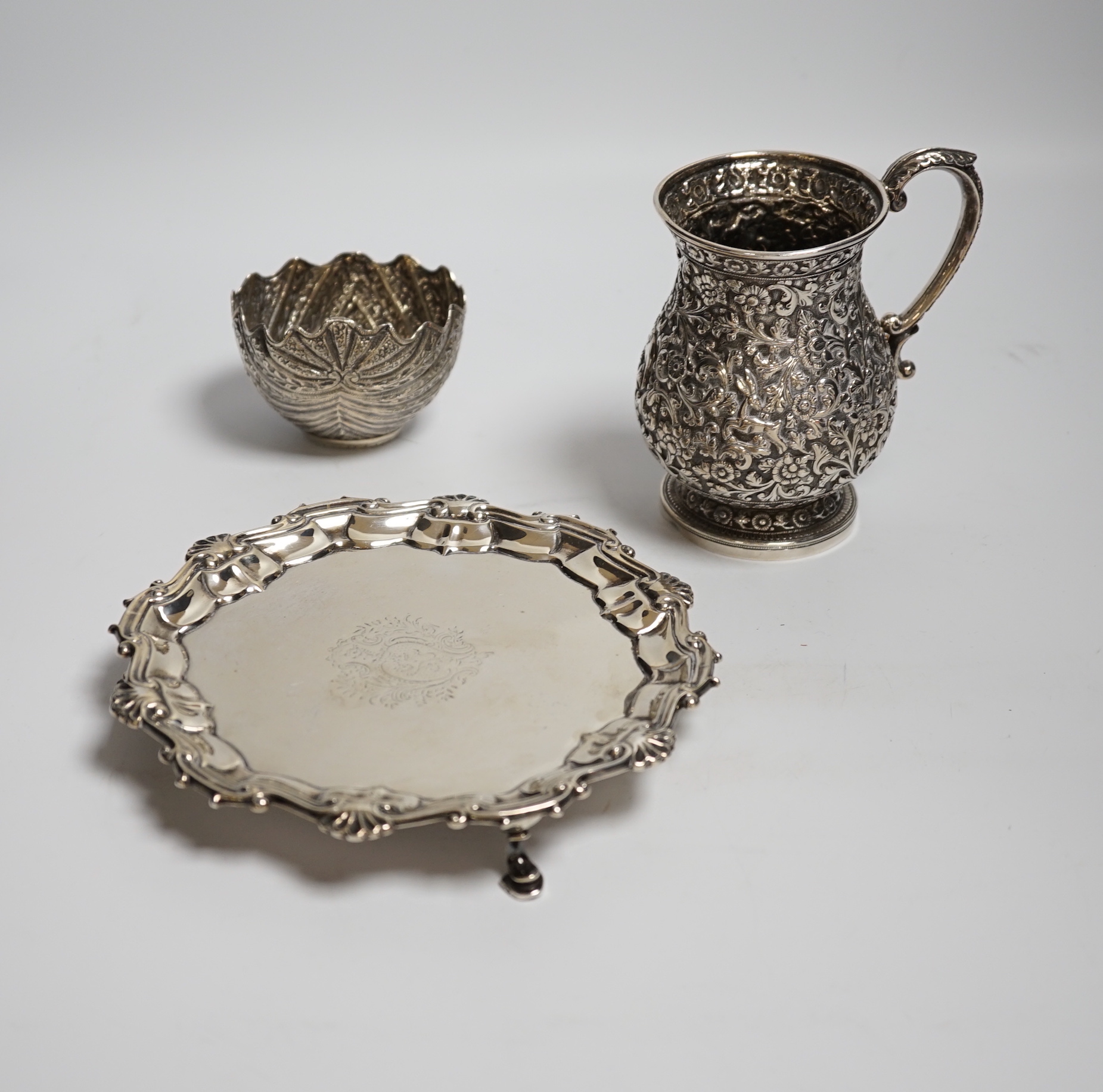 A George II silver waiter, Henry Morris, London, 1747, 17.6cm, together with an Indian? white metal baluster mug and a white metal small bowl.